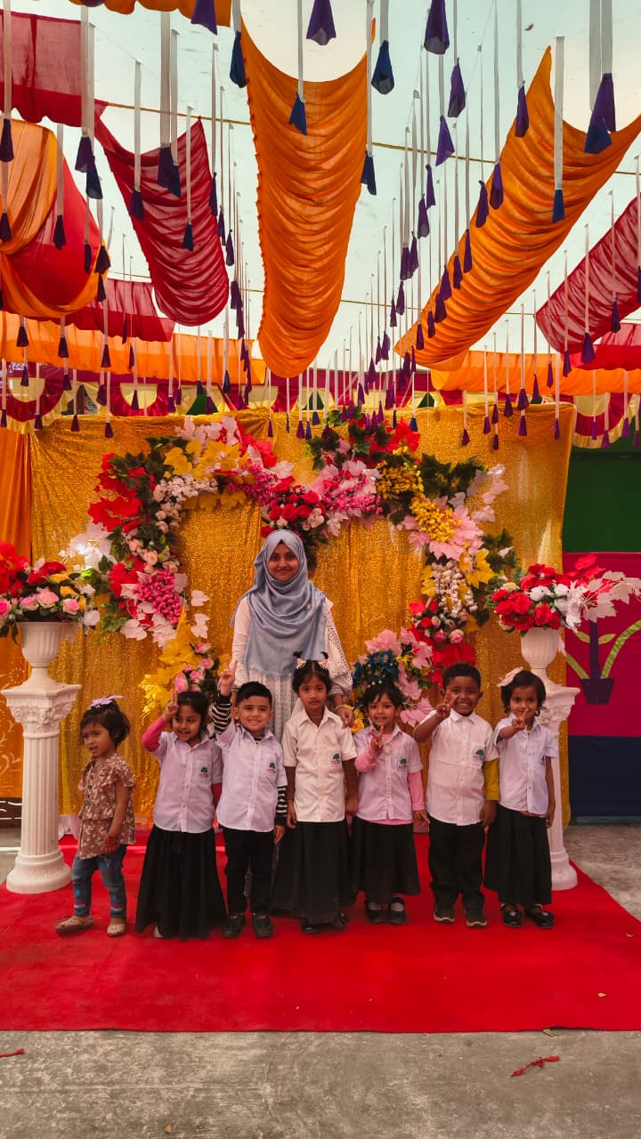 Teachers and children from the English Village School in Bangladesh.