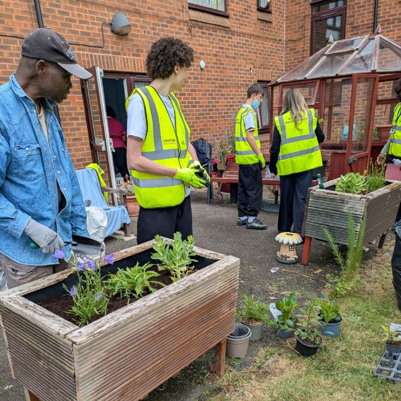 Beckmead Pupils gardening at Extra Care Scheme